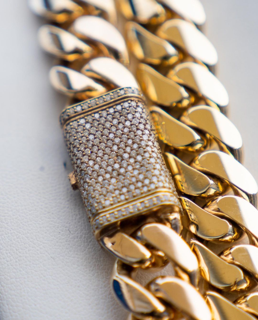 gold miami cuban link chain with sleek diamond lockbox by gus villa jewelry