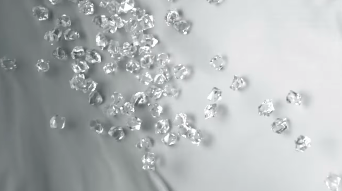 a parcel of small diamonds in front of white sheet