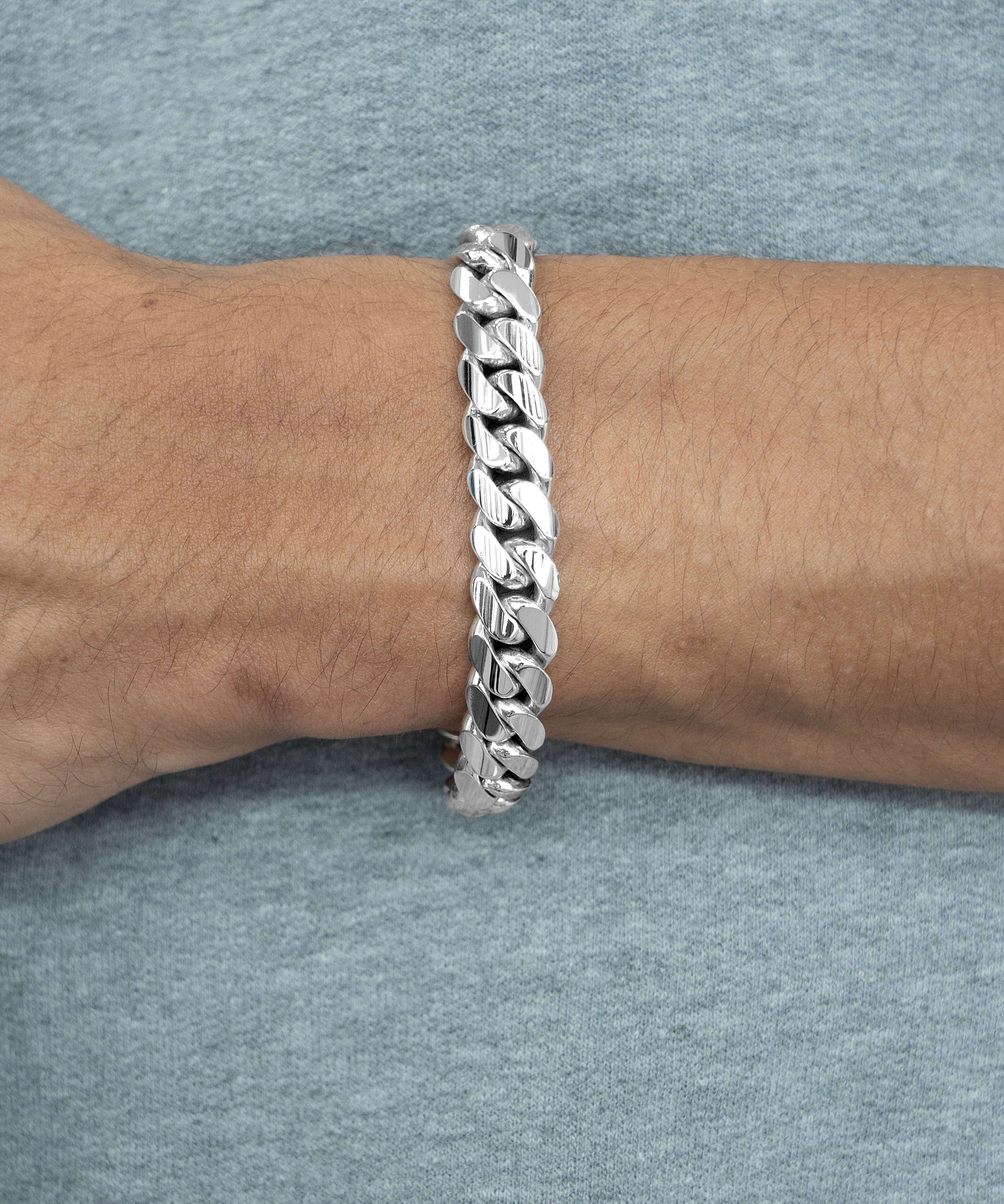 10 mm silver cuban link bracelet on wrist