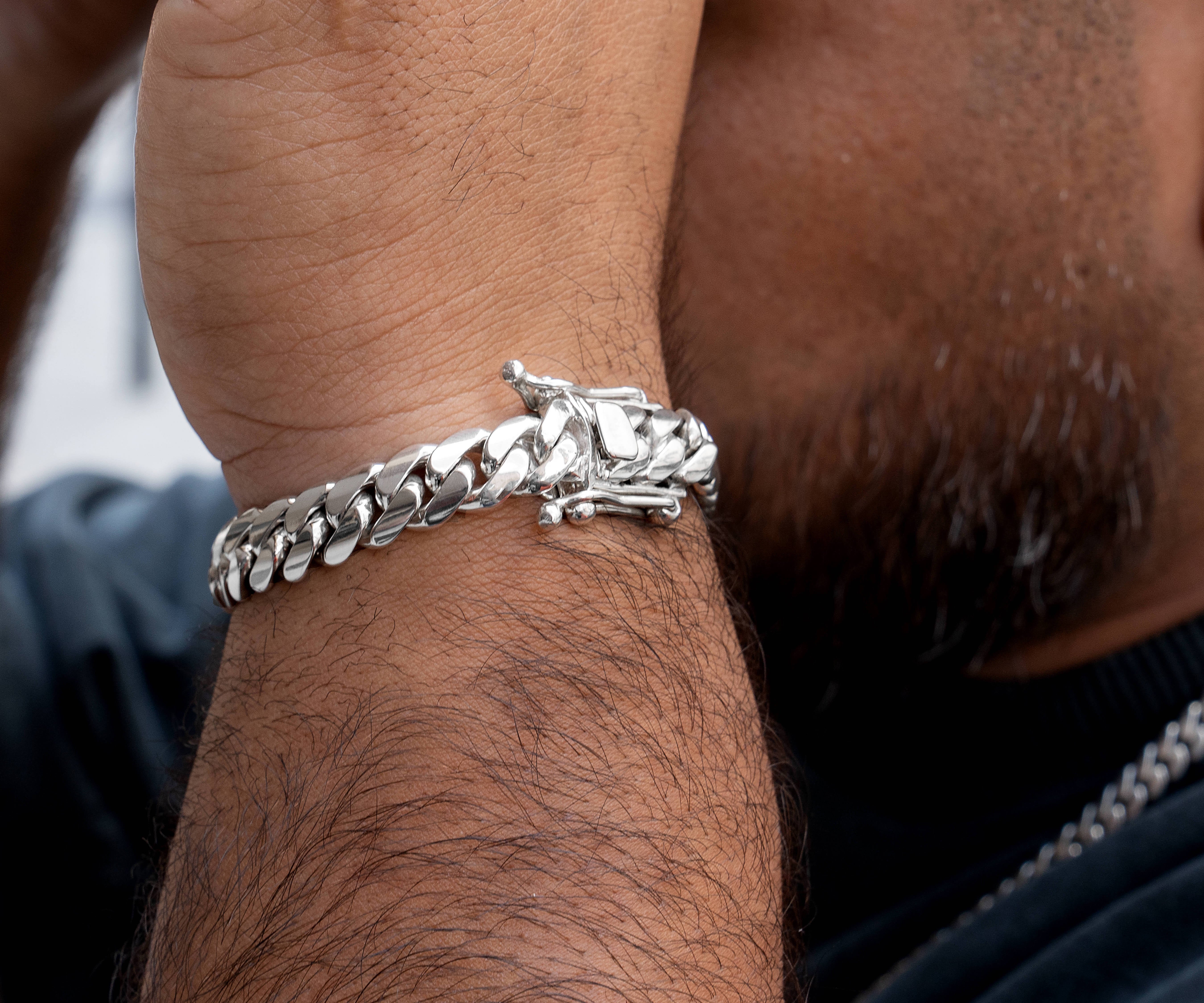 man wearing 10 mm silver cuban link bracelet