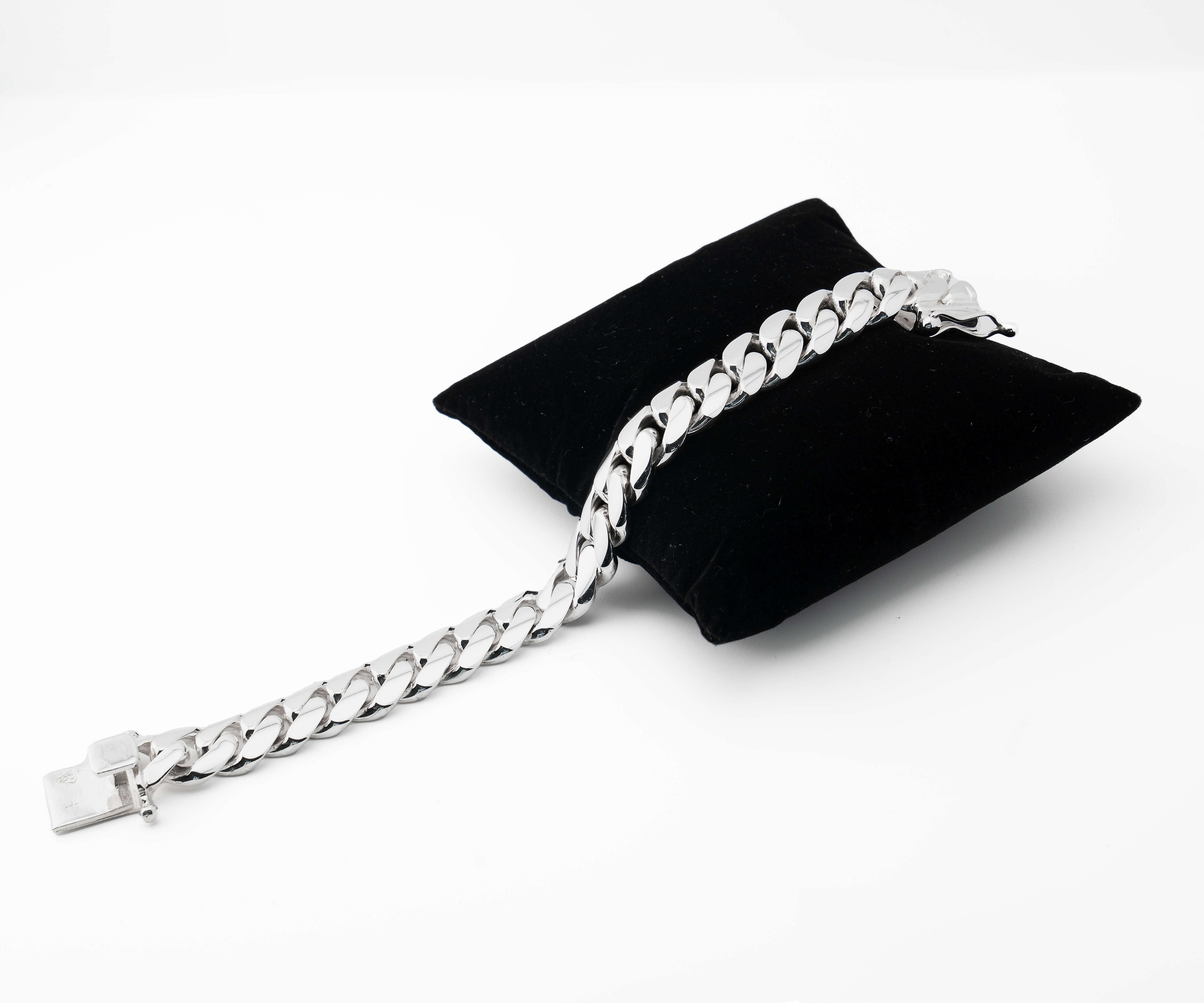 14 mm silver cuban link bracelet on pillow