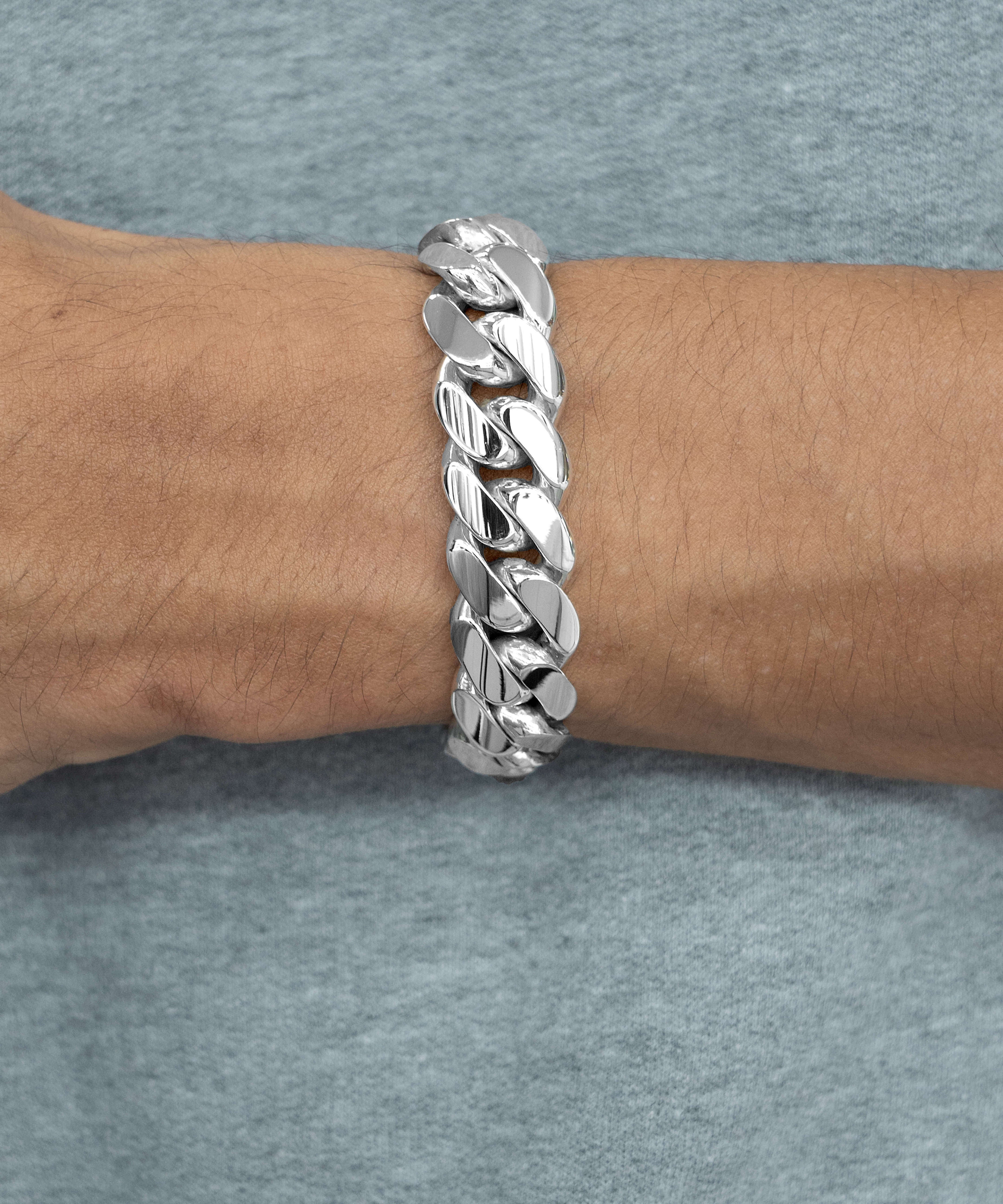 14 mm silver cuban link bracelet on wrist