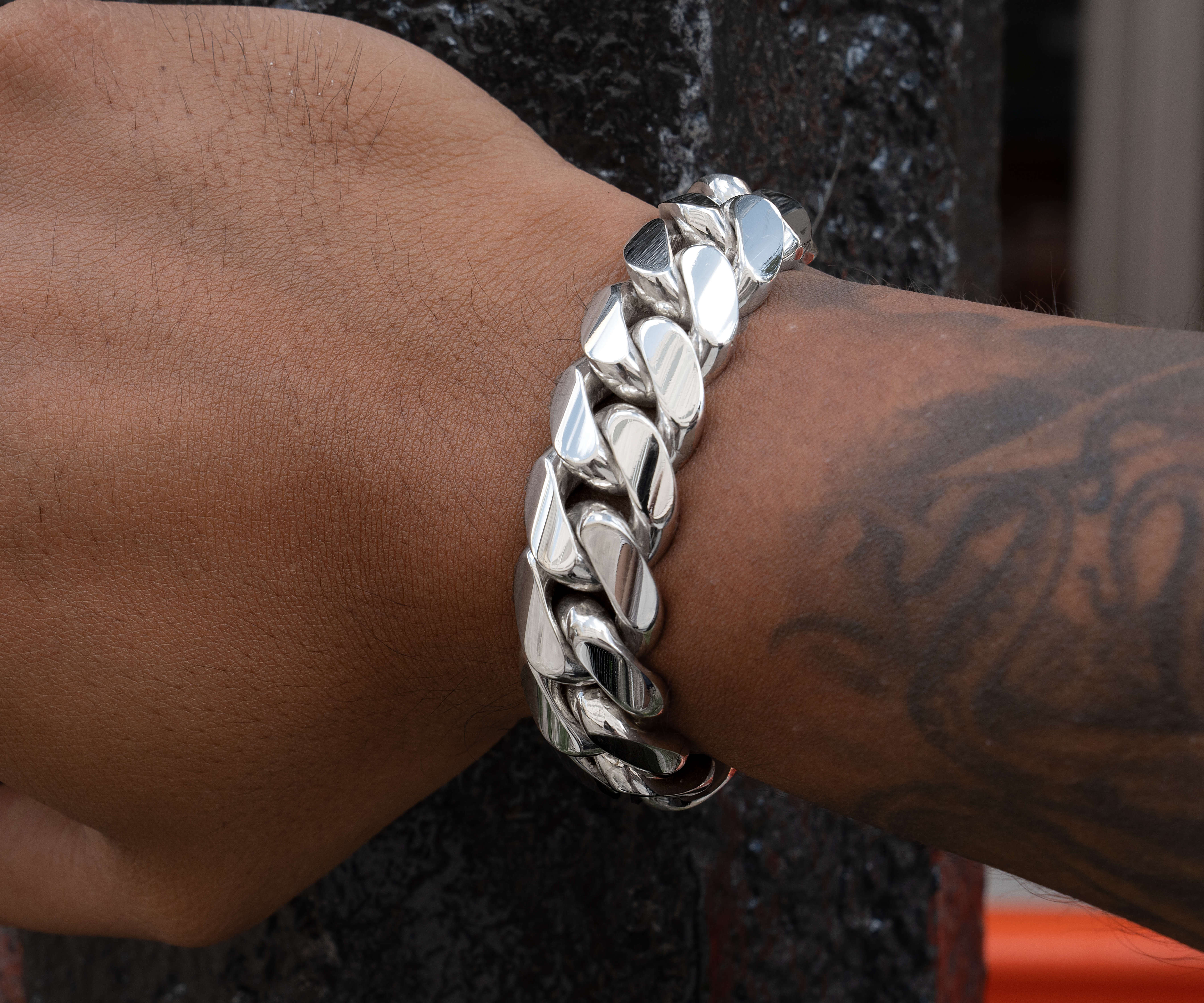 man wearing 18 mm silver cuban link bracelet